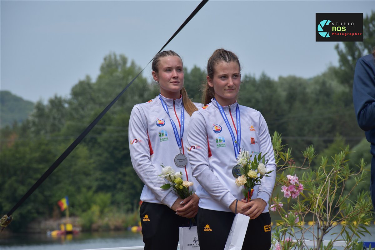 Spanish canoe athletes with silver medals on a European championship podium